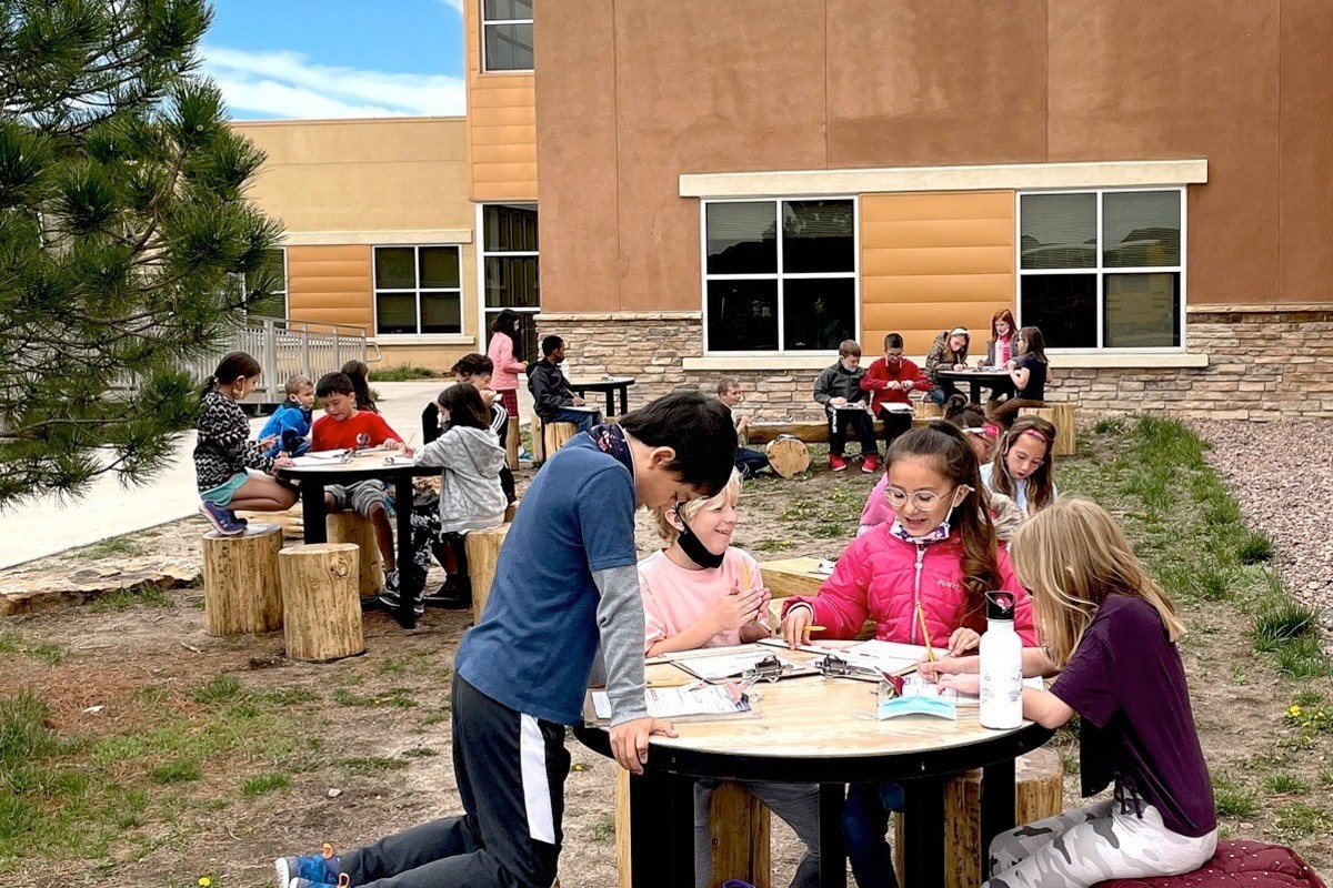 RCES students studying in an outdoor classroom.